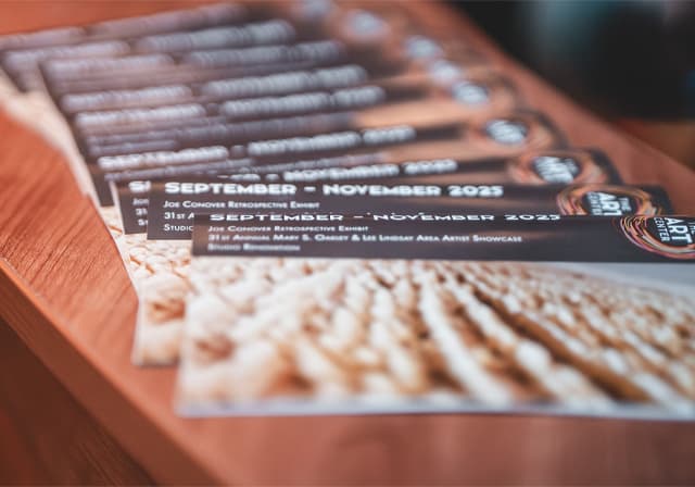 Program sponsor brochures on table