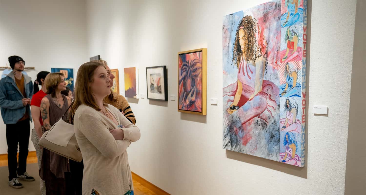 People looking at wall art